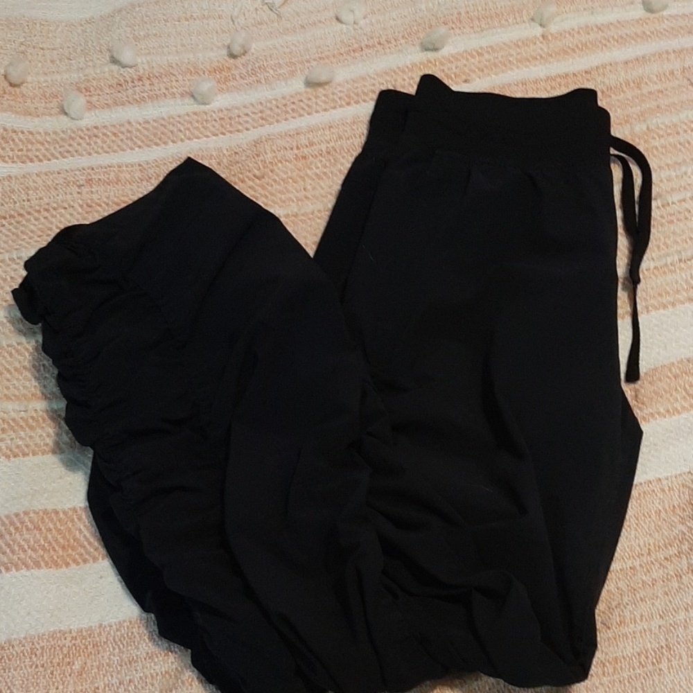 Black Under Armour Storm wind pants/ joggers